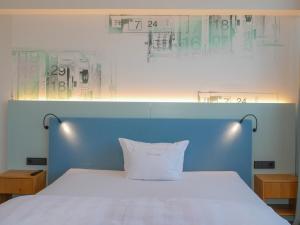 Postel nebo postele na pokoji v ubytování Hotel Federwerk