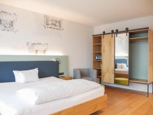 Postel nebo postele na pokoji v ubytování Hotel Federwerk