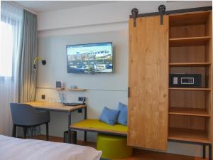 TV a/nebo společenská místnost v ubytování Hotel Federwerk