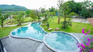 an overhead view of a swimming pool in a garden at Bavi Myan Maison Venuestay in Hanoi