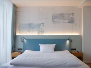 Postel nebo postele na pokoji v ubytování Hotel Federwerk