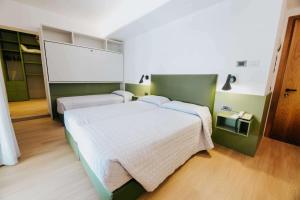 Postel nebo postele na pokoji v ubytování Hotel La Serena