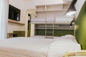 Postel nebo postele na pokoji v ubytování Hotel La Serena