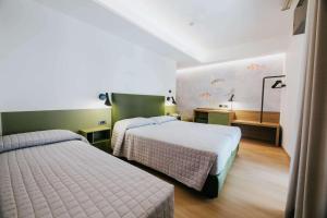 Postel nebo postele na pokoji v ubytování Hotel La Serena