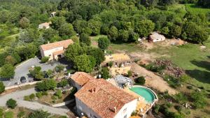 an aerial view of a house with a pool at Les Hauts de Cavanello in Zonza