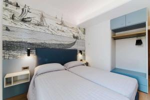 Postel nebo postele na pokoji v ubytování Hotel La Serena
