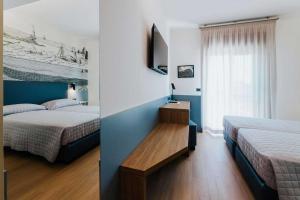 Postel nebo postele na pokoji v ubytování Hotel La Serena
