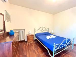 Postel nebo postele na pokoji v ubytování Vittoria Apartament