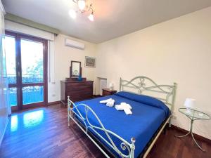 Postel nebo postele na pokoji v ubytování Vittoria Apartament