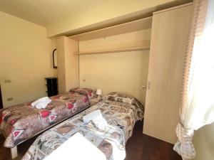 Postel nebo postele na pokoji v ubytování Vittoria Apartament