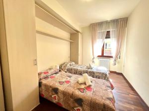 Postel nebo postele na pokoji v ubytování Vittoria Apartament