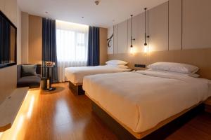 Ένα ή περισσότερα κρεβάτια σε δωμάτιο στο Fairfield by Marriott Harbin Downtown