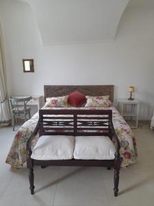 a bedroom with a bed with a red pillow on it at Bellavista in Dolceacqua