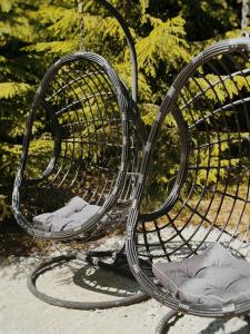 a black park bench with shoes sitting on it at Pedaspä Igloo House and Sauna in Pedaspea +30 photos