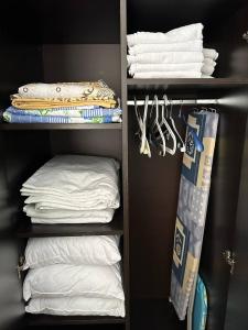 a closet filled with white towels and towels at Siana 4 Apartment (15) in Sveti Vlas