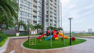 a playground in front of a tall building at Vinhomes Skylake Luxury Apartment 3 Br in Hanoi