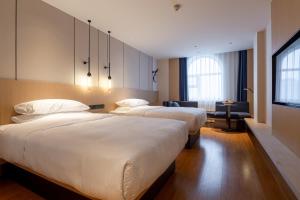 Ένα ή περισσότερα κρεβάτια σε δωμάτιο στο Fairfield by Marriott Harbin Downtown