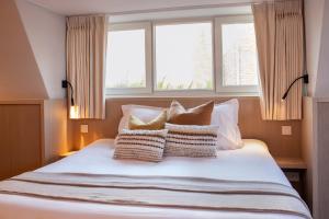 Postel nebo postele na pokoji v ubytování Guesthouse Brouwershuis