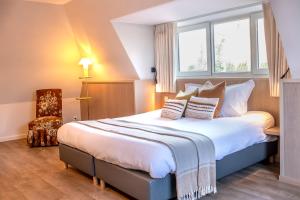 Llit o llits en una habitació de Guesthouse Brouwershuis