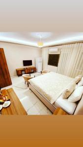 Säng eller sängar i ett rum på Hasanbey Apart Otel