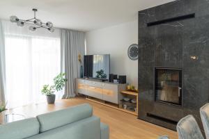 Μια τηλεόραση ή/και κέντρο ψυχαγωγίας στο Apartmán Breeze