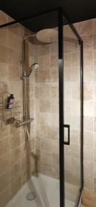a shower with a glass door in a bathroom at Studio 4/5 personnes au pied des pistes Les Orres in Les Orres