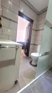 a bathroom with a toilet and a sink at 2 bedrooms appartement with wifi at Bruxelles in Bons Villers