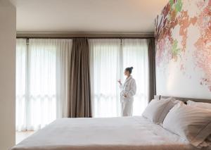 Postel nebo postele na pokoji v ubytování QC Room San Pellegrino