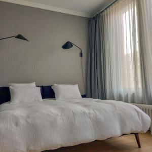 Postel nebo postele na pokoji v ubytování Boutique Hotel Marie Marie