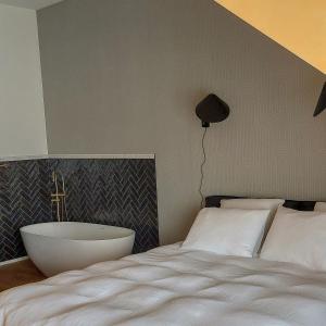 Postel nebo postele na pokoji v ubytování Boutique Hotel Marie Marie