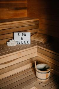a sauna with a sign that reads s pa and relax at Hotel Villa Sorriso in Lido di Jesolo