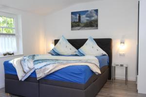 Postel nebo postele na pokoji v ubytování Kleine Veranda