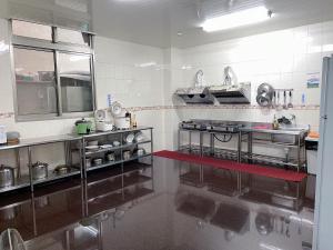 Kuchyň nebo kuchyňský kout v ubytování Chia Yuen Homestay