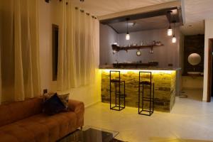 a living room with a couch and a bar at Imlil apartment in Azrou