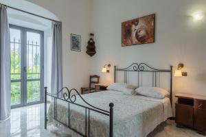Postel nebo postele na pokoji v ubytování Casa dei Renai by Rentbeat