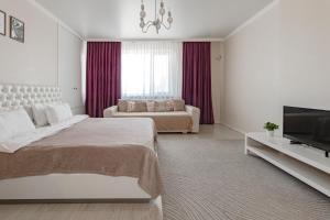 Postel nebo postele na pokoji v ubytování Арман Кала - 8 жилой комплекс