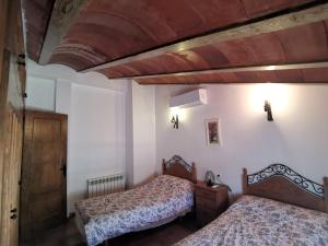 Postel nebo postele na pokoji v ubytování Casa Rural El Gandulillo