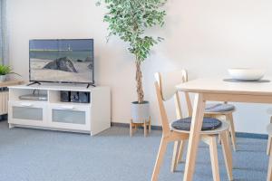 En TV eller et underholdningssystem på Haus Dieksee Holm Seepanorama