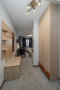 an office room with wooden cabinets and a desk at City Code Spa in Belgrade