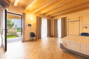 a bedroom with a bed and a table and a chair at Casale Ferrantino in Giulianova