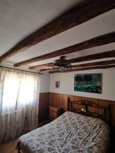 Postel nebo postele na pokoji v ubytování Casa Rural El Gandulillo