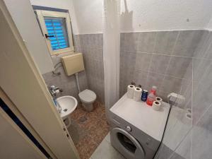 a small bathroom with a toilet and a sink at Apartman Irina Trebinje in Trebinje