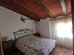Postel nebo postele na pokoji v ubytování Casa Rural El Gandulillo