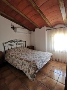 Postel nebo postele na pokoji v ubytování Casa Rural El Gandulillo