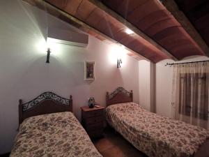Postel nebo postele na pokoji v ubytování Casa Rural El Gandulillo