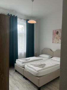 Postel nebo postele na pokoji v ubytování Hotel Lübecker Hof