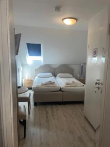 Postel nebo postele na pokoji v ubytování Hotel Lübecker Hof