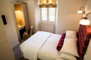 Postel nebo postele na pokoji v ubytování The Broadmead Boutique B&B