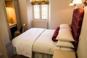 Postel nebo postele na pokoji v ubytování The Broadmead Boutique B&B
