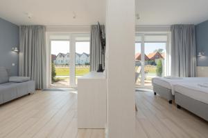 Postel nebo postele na pokoji v ubytování BURSZTYN - BERNSTEIN APARTMENTS